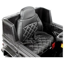 a close up of the seat of a black jeep.