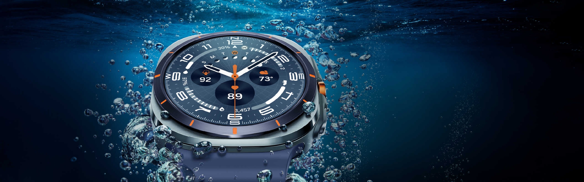 A Galaxy Watch Ultra is seen close-up in the water near the surface, showcasing its design.