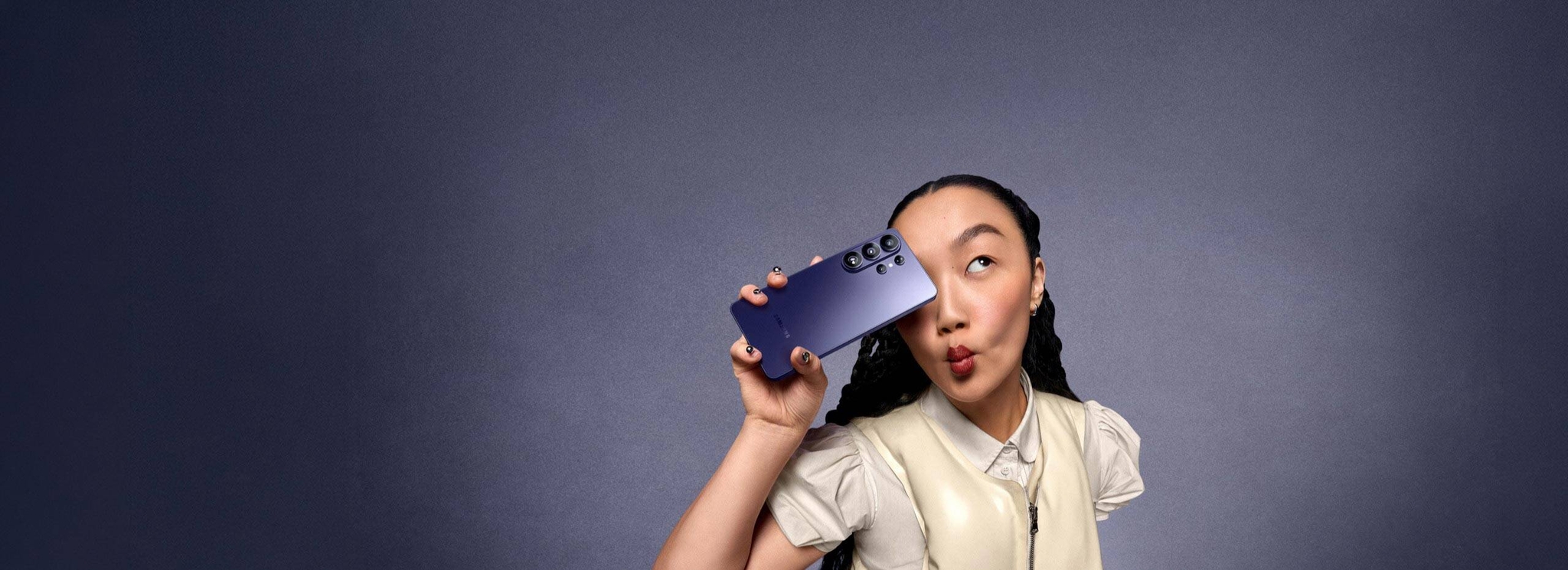 Close up of the corner of Galaxy S26 Ultra in Cobalt Violet showing camera lenses is seen. S Pen is seen in front of the device. Galaxy AI.