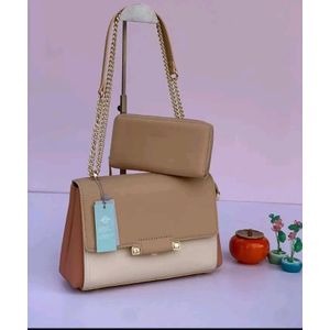 CHRISBELLA Two tone faux leather shoulder bag with a beige upper portion and a cream white lower portion with a matching beige pouch 