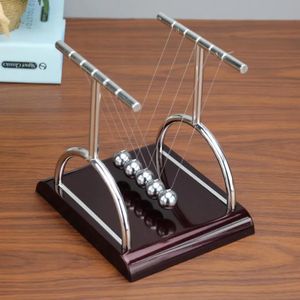 B Bra Newton's pendulum balls Cradle a classic science desk toy used to demonstrate physics principles like conservation of momentum and energy. 