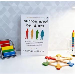 SURROUNDED BY IDIOTS 