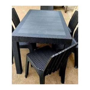 black set features a rectangular table with a woven rattan-style pattern with no 