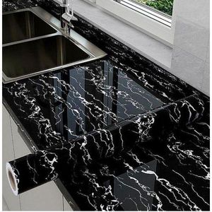 Roll of marble contact paper, a self-adhesive, peel-and-stick vinyl material used for covering surfaces.