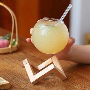 Modern Spherical Glass Beverage Vessel with Geometric Wooden Stand