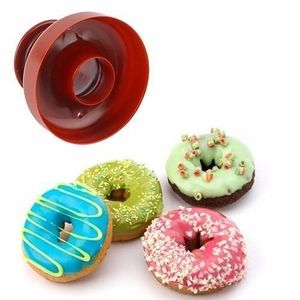  A manual plastic donut cutter mold.Multicolour