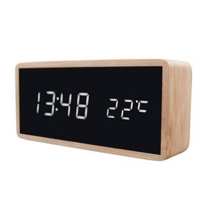 modern digital alarm clock with a light wood-colored casing