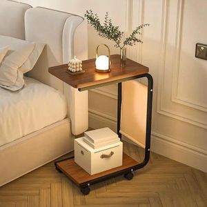 C-shaped side table features a dark walnut wood top, a black metal frame, and caster wheels.